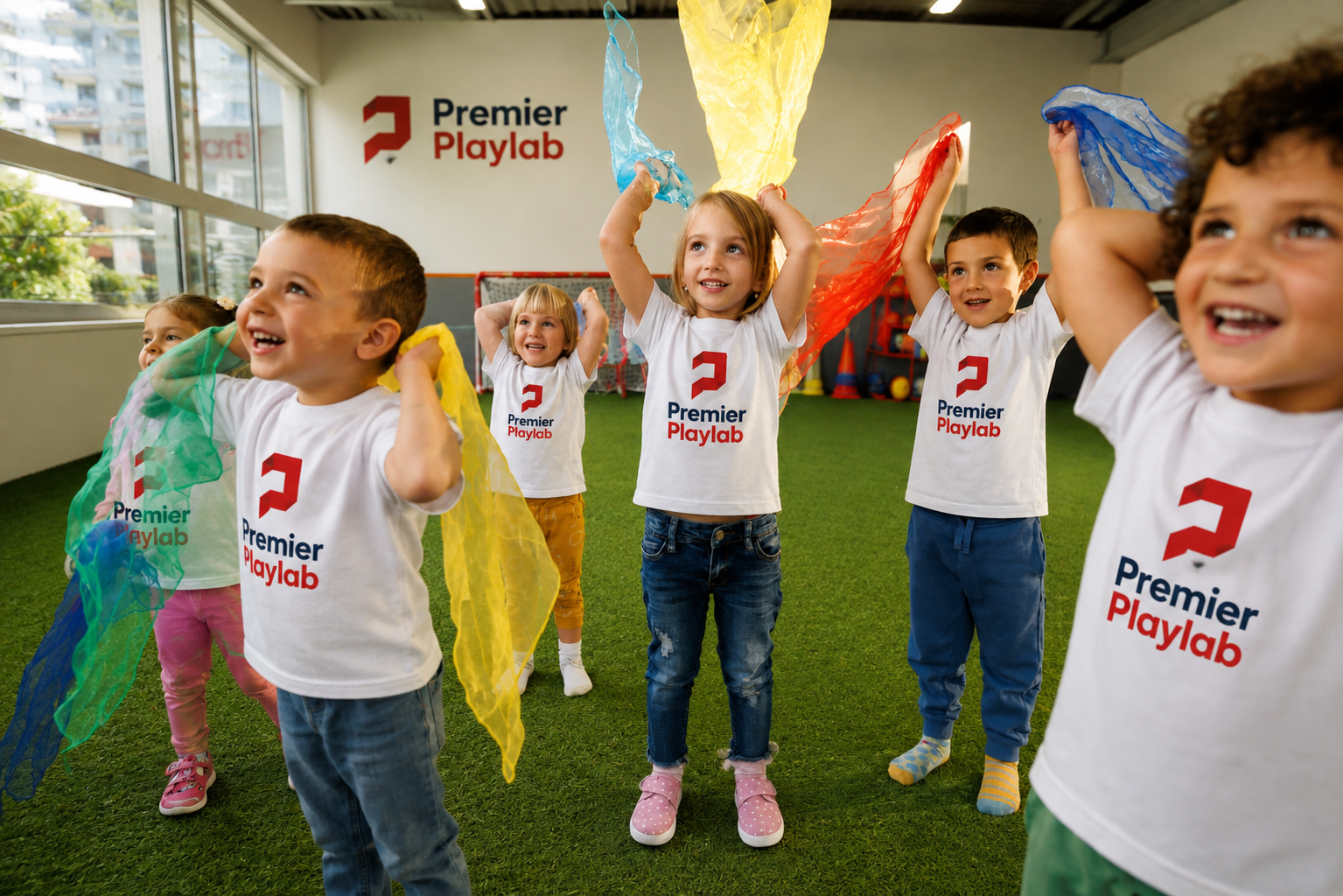 Children playing with colorful scarves in Premier Playlab movement class